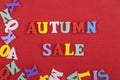 Autumn sale word on red background composed from colorful abc alphabet block wooden letters, copy space for ad text. Learning Royalty Free Stock Photo