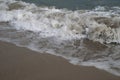 Waves rushing over wet sand on Stokes Bay beach Royalty Free Stock Photo