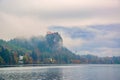 Autumn scenery of Bled lake at foggy autumn morning Royalty Free Stock Photo