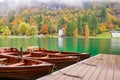 Autumn scenery with boats moored on Bled lake, Slovenia Royalty Free Stock Photo