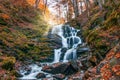 Autumn scenery with famous waterfall Shypit near Volovetz in Carpathian mountains, Ukraine