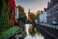 The autumn scenery of Gdansk at sunrise with a wall covered with red ivy leaves. Poland Royalty Free Stock Photo