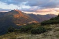 Autumn scenery. Mountain landscape with beautiful sunset, cloudy sky and orange colorful horizon. Copy space for text. Sunny day