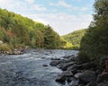 Autumn scenery photos. River with rocks, trees, bleu sky, clouds. Image. Picture. Photo