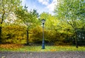 Autumn scenery with a retro street lamp in a park Royalty Free Stock Photo