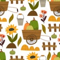Autumn seamless pattern with cartoon pumpkins, bucket, cart, sunflower, decorative  elements. Season, nature theme. Royalty Free Stock Photo