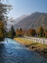 Autumn season. Beautiful view of the Austrian Alps with colorful nature, trees, leaves and a stream in Kaprun, Austria Royalty Free Stock Photo