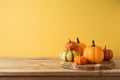 Autumn season concept with pumpkin decor on wooden table. Halloween or Thanksgiving greeting card