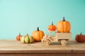 Autumn season concept with toy truck and pumpkin decor on wooden table. Halloween or Thanksgiving greeting card Royalty Free Stock Photo