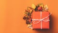 Autumn season decor gift box orange background Royalty Free Stock Photo