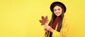 Autumn season, fashion teenager. fall season fashion. teen girl in hat hold autumn leaf. happy child with maple leaf
