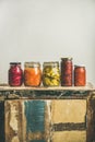 Autumn pickled vegetables in jars placed in line, copy space Royalty Free Stock Photo