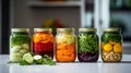 Autumn seasonal pickled or fermented vegetables in jars placed in row over vintage kitchen drawer, white wall background Royalty Free Stock Photo