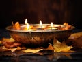 Autumn Serenity: Tarnished Brass Bowl with Floating Candles and Leaves on a Smooth Slate Canvas