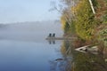 Autumn Shoreline and Dock on a Misty Morning