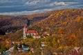 Autumn at Sklene Teplice with church at Stiavnicke vrchy mountains