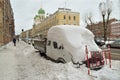 Autumn snowfall in the city. Royalty Free Stock Photo