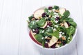 Autumn spinach salad with apple cheese , walnut and dried cranberry . Healthy vegetarian food