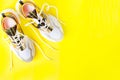 Autumn sports shoes on a yellow background