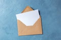 Autumn stationery mockup, overhead flat lay shot of a greeting card or invitation in a brown craft envelope Royalty Free Stock Photo