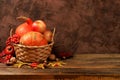 Autumn still life with apples, rowan berries, pumpkins, sunflower flowers on an old wooden table, background, Thanksgiving concept Royalty Free Stock Photo