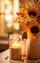 Autumn still life, Candle, autumn flowers sunflowers in a vase on the table Royalty Free Stock Photo