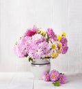 Autumn still life with colorful Chrysanthemums bunch on old white wooden table