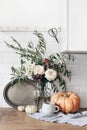 Autumn still life composition. Cup of coffee, vintage silver tray and floral bouquet. Fall kitchen still life with Royalty Free Stock Photo