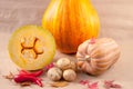 Autumn still life with a crop of vegetables : pumpkin, potatoes with maple leaves