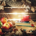 Autumn still life with a cup of coffee, apples and autumn leaves. Autumn background. Royalty Free Stock Photo