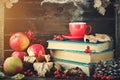 Autumn still life with a cup of coffee, apples and autumn leaves. Autumn background. Royalty Free Stock Photo
