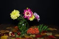 Autumn still life with dahlias and a rowan branch Royalty Free Stock Photo