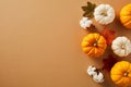 Autumn still life. Flat lay pumpkins, cotton, and maple leaves on brown background. Happy Thanksgiving banner design Royalty Free Stock Photo