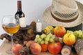 Autumn still life with fruits, candles and hat Royalty Free Stock Photo