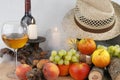 Autumn still life with fruits, candles and hat Royalty Free Stock Photo