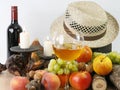 Autumn still life with fruits, candles and hat Royalty Free Stock Photo