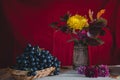 Autumn still life grapes and autumn flowers Royalty Free Stock Photo