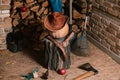 Autumn still life. Pumpkin, tool, firewood, hat on veranda Royalty Free Stock Photo