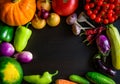 Autumn still life with pumpkin, watermelon, and a variety of colorful vegetables on black wooden background. Happy Thanksgiving Royalty Free Stock Photo