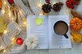 Autumn still life with pumpkins, book,coffee,leaves and pinecone