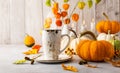 Autumn still life with pumpkins, flowers and candles on table.Thanksgiving day or halloween concept Royalty Free Stock Photo
