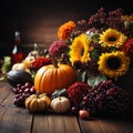 Autumn still life with pumpkins, grapes and flowers on wooden background Royalty Free Stock Photo