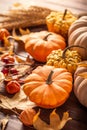 Autumn still life with pumpkins and leaves on wooden background. Thanksgiving home decoration Royalty Free Stock Photo