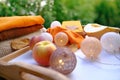 autumn still life in style Scandinavian hugg with woolen clothes in garden, melon, yellow leaves, books on wooden table, garlands