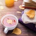 Autumn still life with tea and yellow leaves