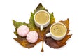 Autumn still life. Two white cups of coffee and rose marshmallows on a huge maple leaf. Top view, isolated on white Royalty Free Stock Photo