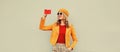 Autumn style outfit, stylish smiling young woman taking selfie with smartphone wearing orange french beret hat, jacket and round Royalty Free Stock Photo