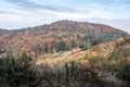 Autumn Sulovske skaly mountains in Slovakia with hill with colorful forest and hut on smal meadow