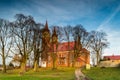 Autumn sun setting illuminates the walls of the church.