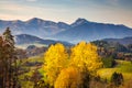 Autumn sunny rural landscape with mountains at background